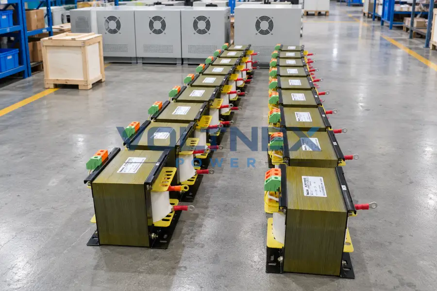 Transformer core, copper windings and electrical components prepared for dry type transformer assembly